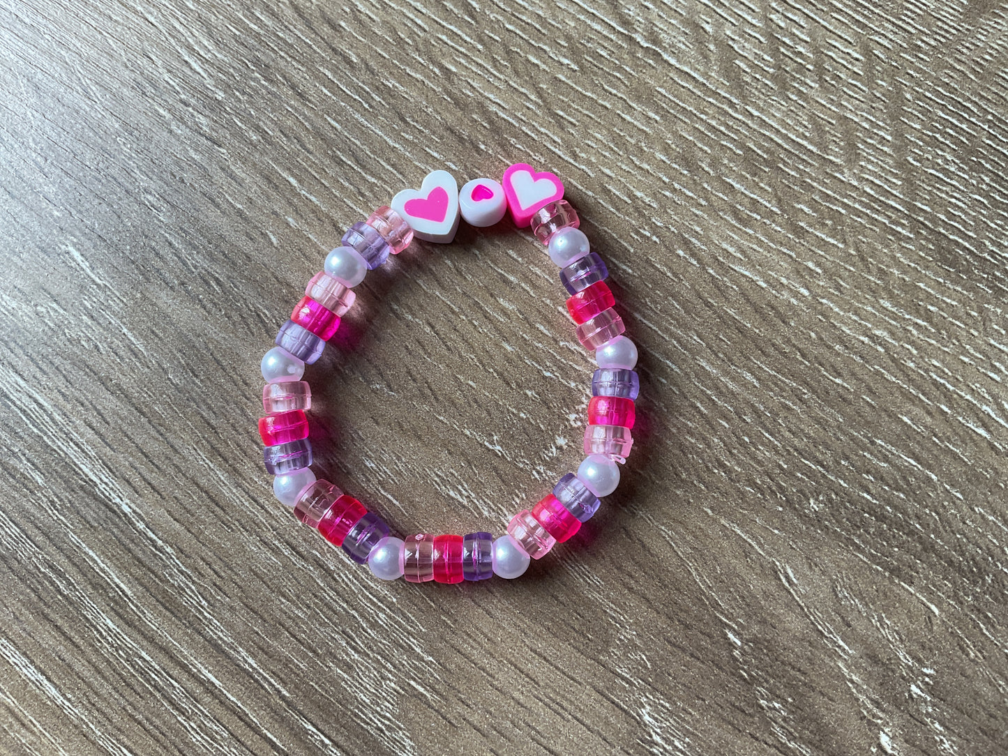 Kids pink and pearl bead bracelet with hearts