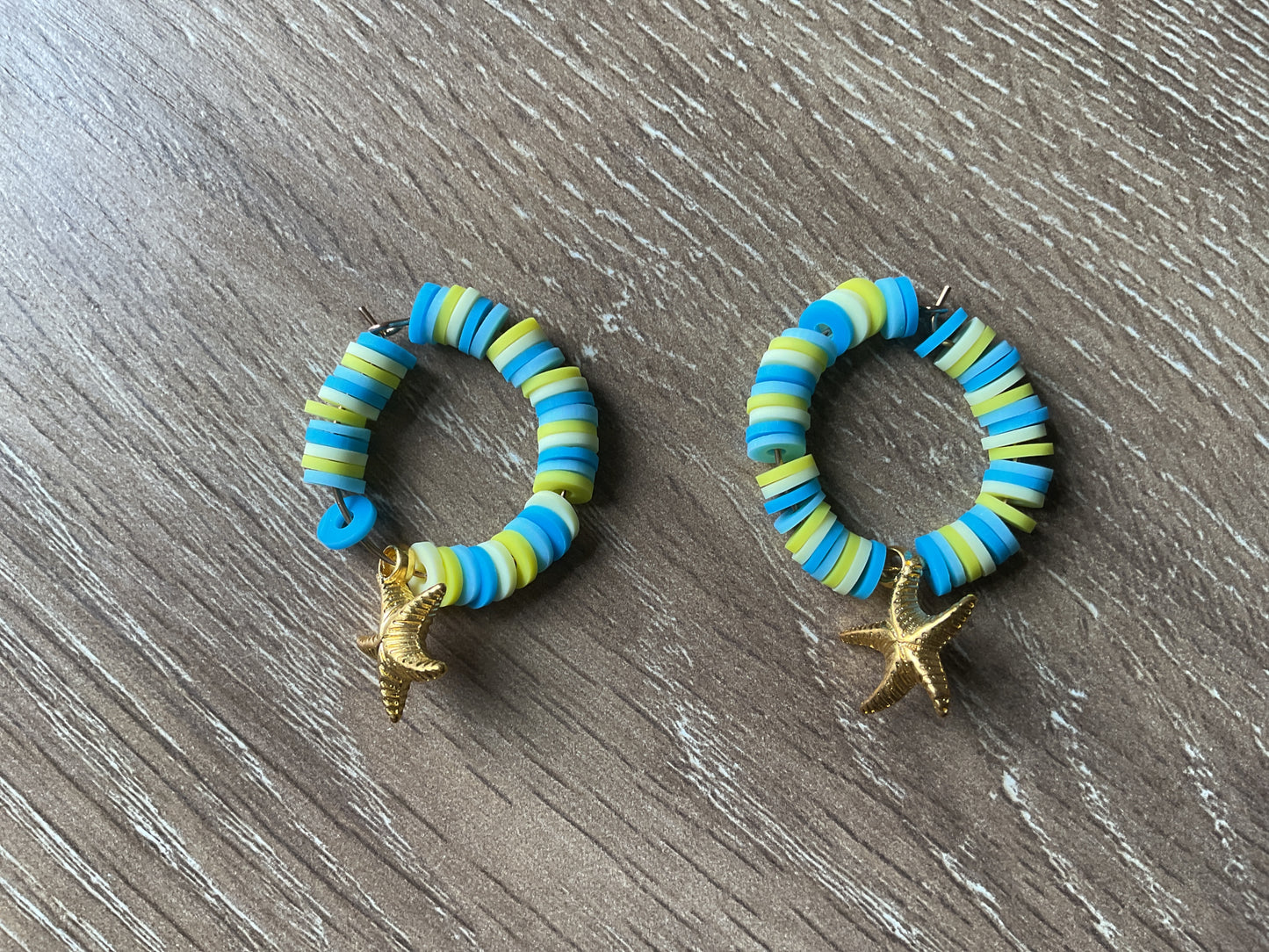 Summery blue and yellow and golden starfish earrings
